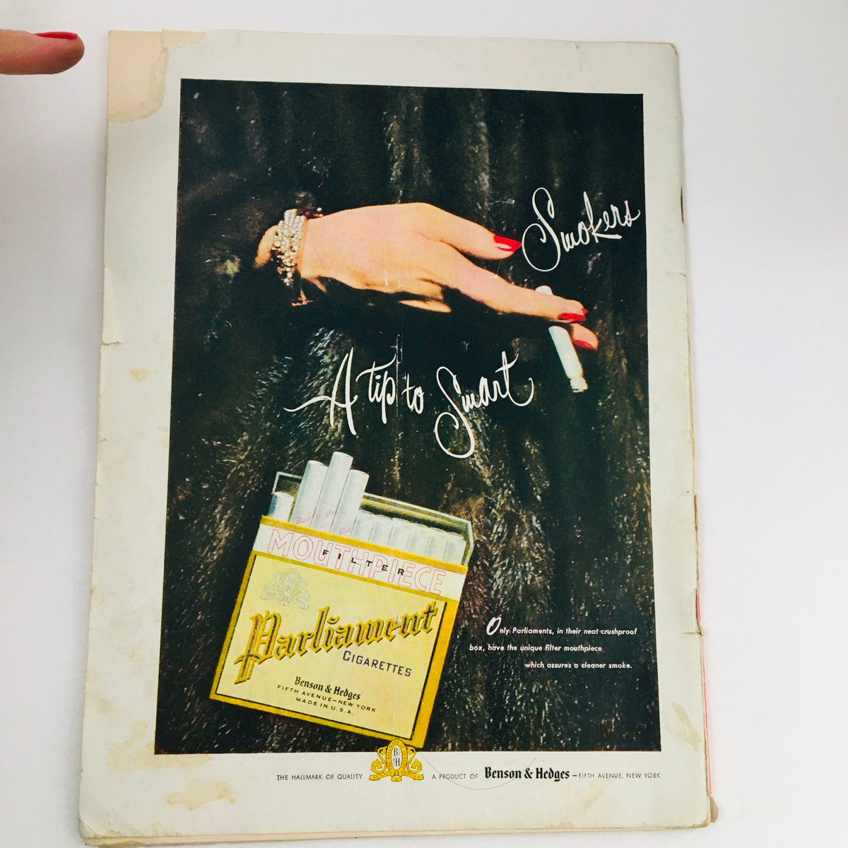 The New Yorker January 17 1948 magazine back cover advertisement for Parliament cigarettes featuring a glamorous hand holding a cigarette.