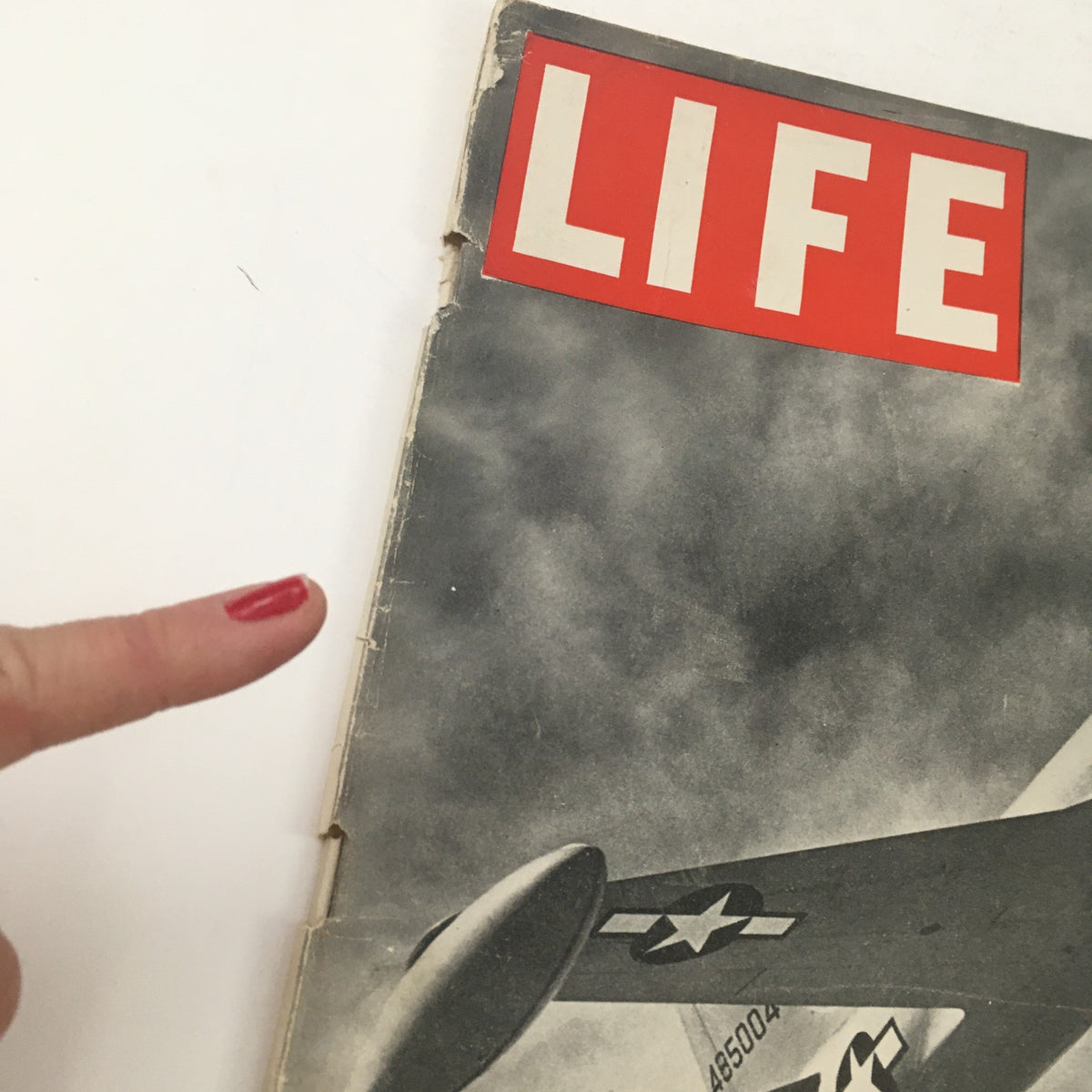 Close-up view of the Life Magazine August 13 1945 cover showing the P-80 Shooting Star Fighter Plane with a finger pointing, emphasizing its significance in aviation history.