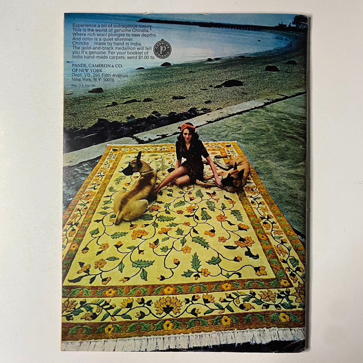 Back cover of The New Yorker Full Magazine April 28, 1975 featuring a woman on a colorful carpet by the beach with dogs, showcasing luxurious Chindia rugs.