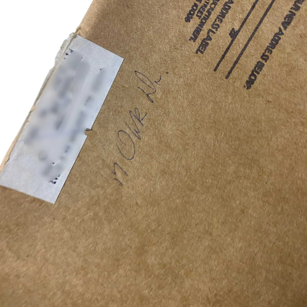 Close-up view of the shipping label on the back cover of The New Yorker Full Magazine February 9, 1976 with handwritten marking.
