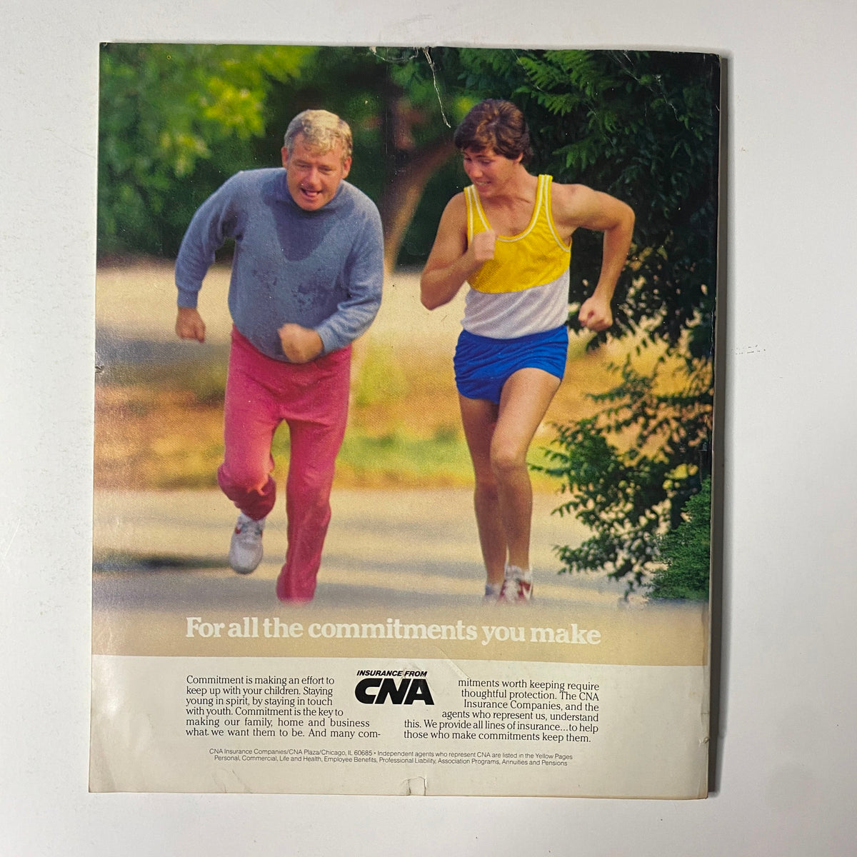 Back cover of Fortune Magazine February 6, 1984, displaying an advertisement for CNA insurance with two men jogging outdoors.