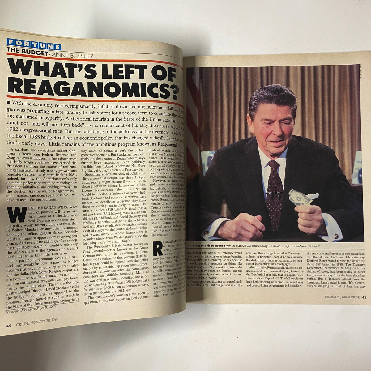 Inside page from Fortune Magazine February 20, 1984, featuring an article titled 'What's Left of Reaganomics?' with an image of Ronald Reagan holding a dollar bill.