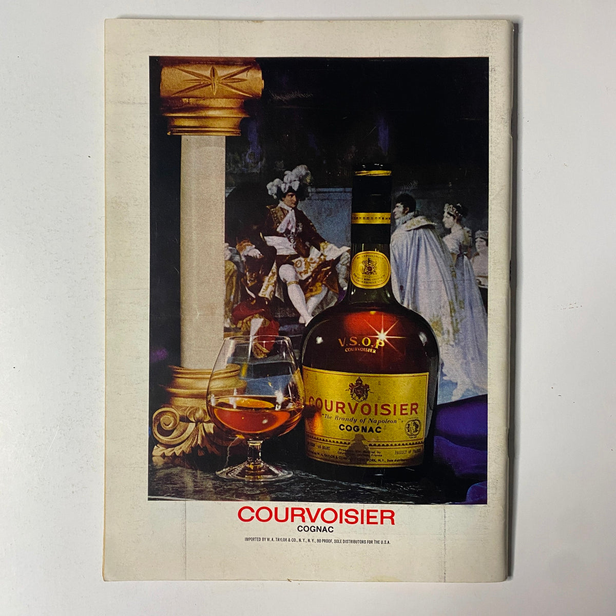 Advertisement for Courvoisier Cognac featured in The New Yorker magazine, April 14, 1975, showcasing a bottle and glass with a classical painting backdrop.