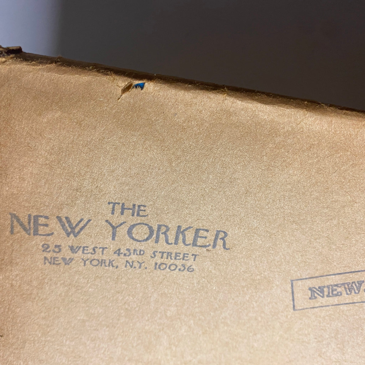 Close-up of the back cover of The New Yorker magazine, April 14, 1975, featuring embossed lettering of the magazine name and mailing address.