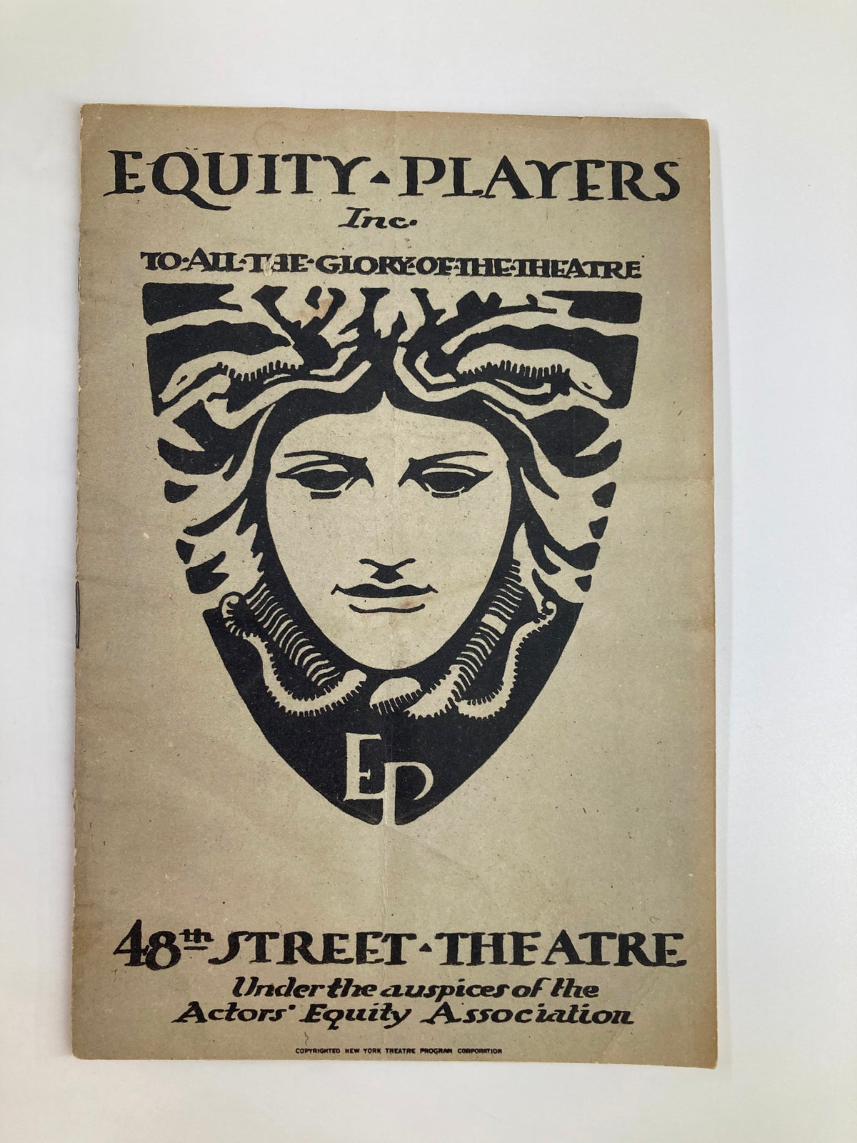 Cover of the 1924 Equity Players Inc. Playbill featuring an artistic design with a central face illustration, representative of theater, titled 'To All the Glory of the Theatre'.