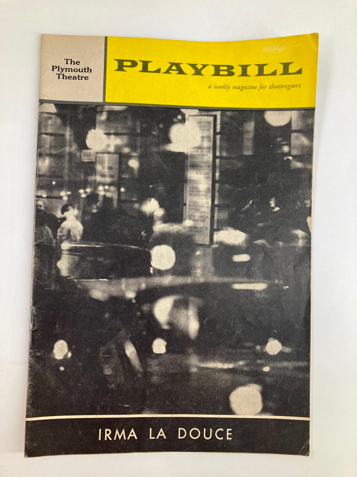 1961 Playbill from The Plymouth Theatre featuring the musical 'Irma La Douce' with a vintage black and white design.