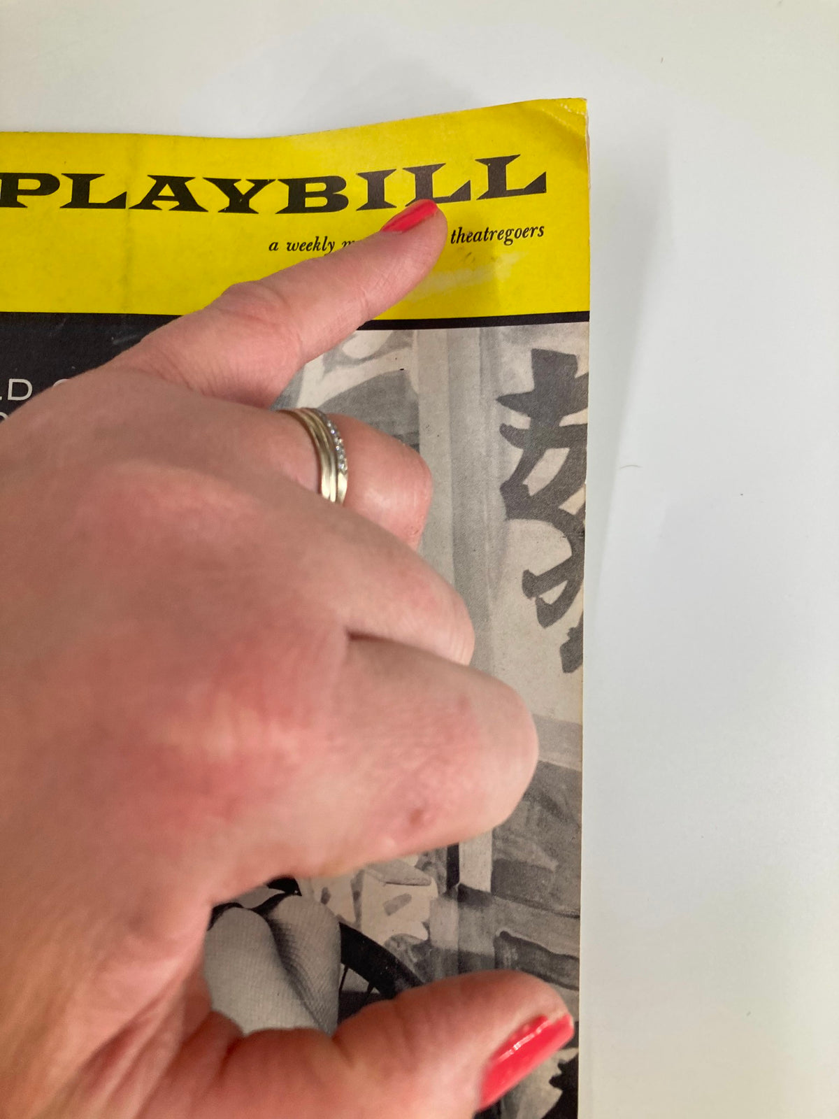 Close-up view of the top portion of the 1959 Playbill The World of Suzie Wong, showcasing the title and logo of the Broadhurst Theatre.