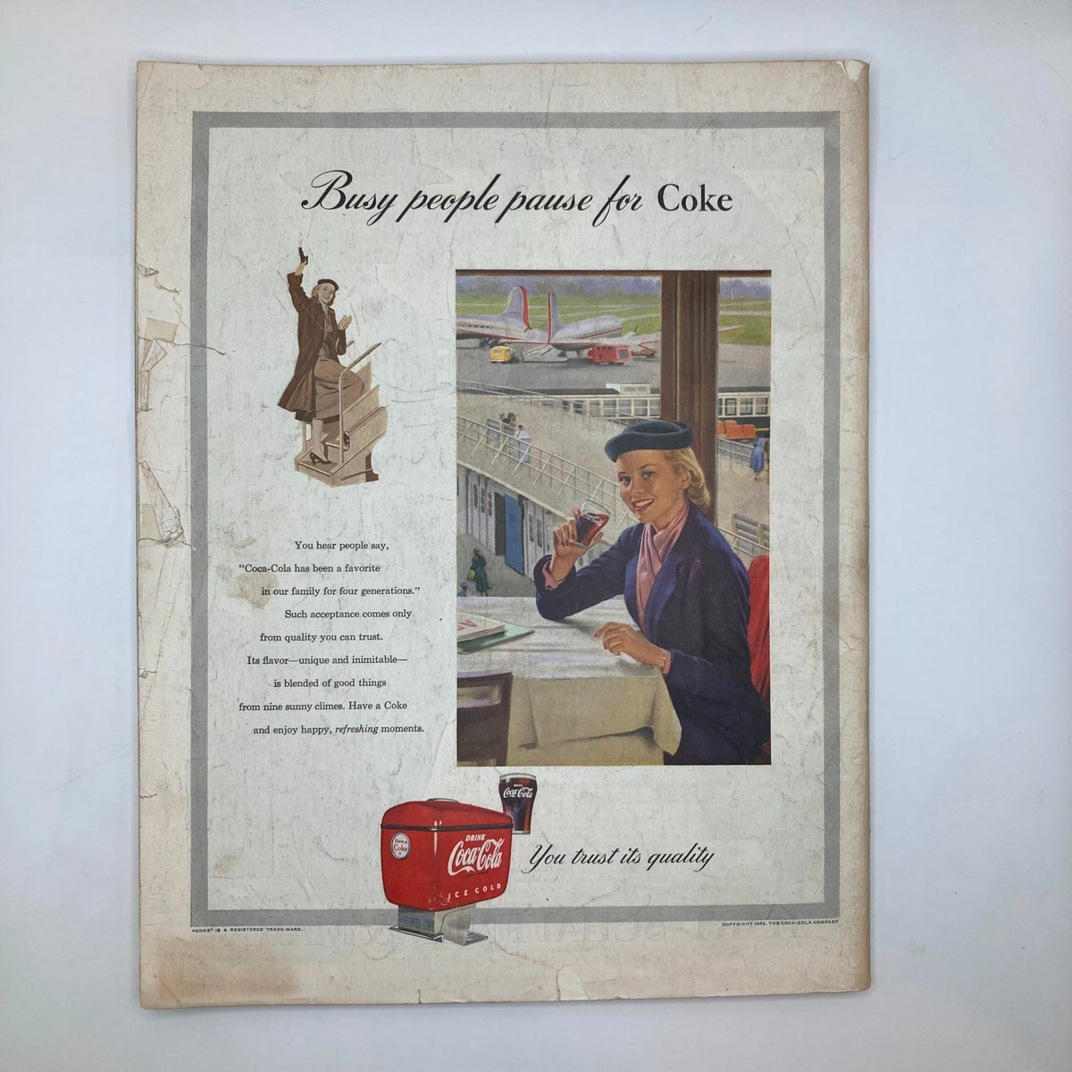 Back cover of Saturday Evening Post Magazine March 21, 1953 featuring vintage advertisement for Coca-Cola, depicting a stewardess and airplane, emphasizing leisure moments with a Coke.