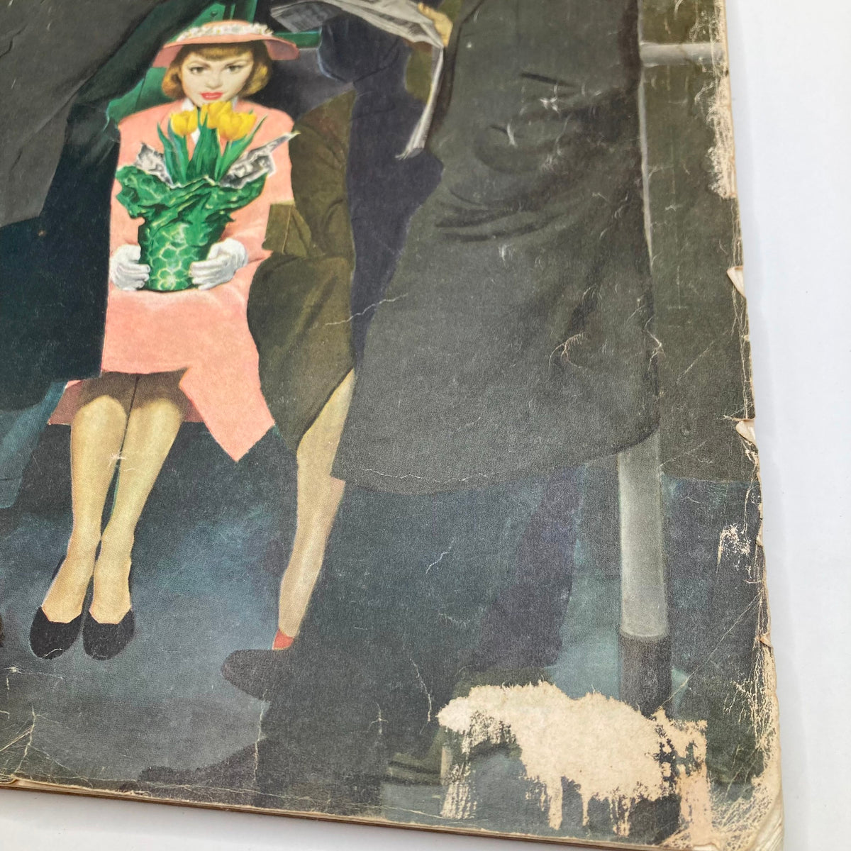 Close-up view of the cover of Saturday Evening Post Magazine March 28 1953, highlighting the vibrant colors and details of the artwork depicting a woman and her floral arrangement.