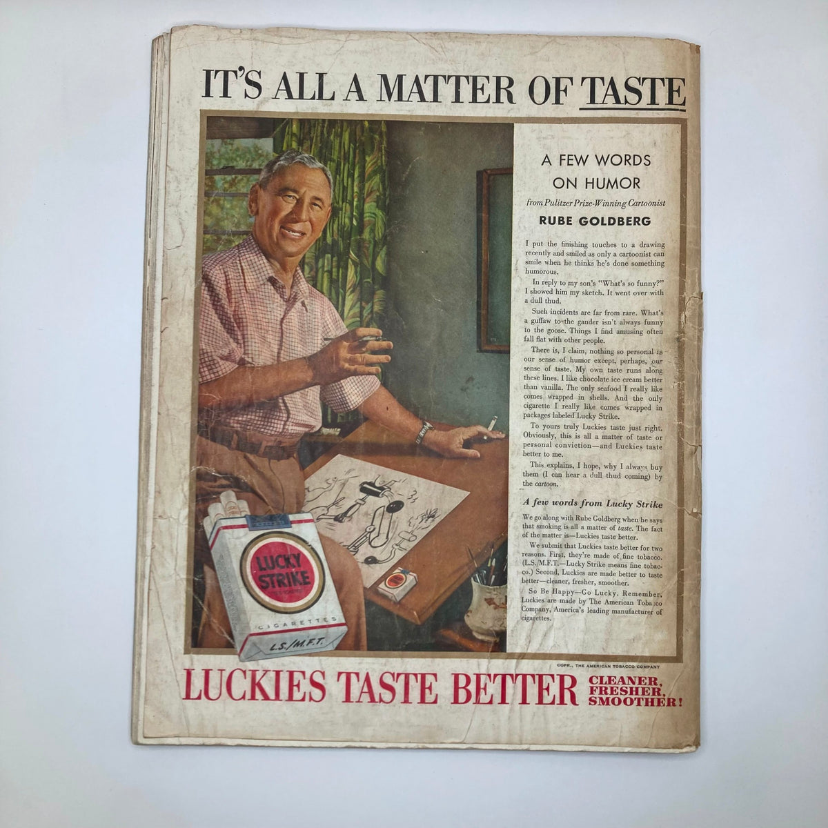 Back cover of the Saturday Evening Post Magazine May 1 1954, featuring a colorful illustration related to Rube Goldberg and Lucky Strike cigarettes, reflecting the era's advertising style.