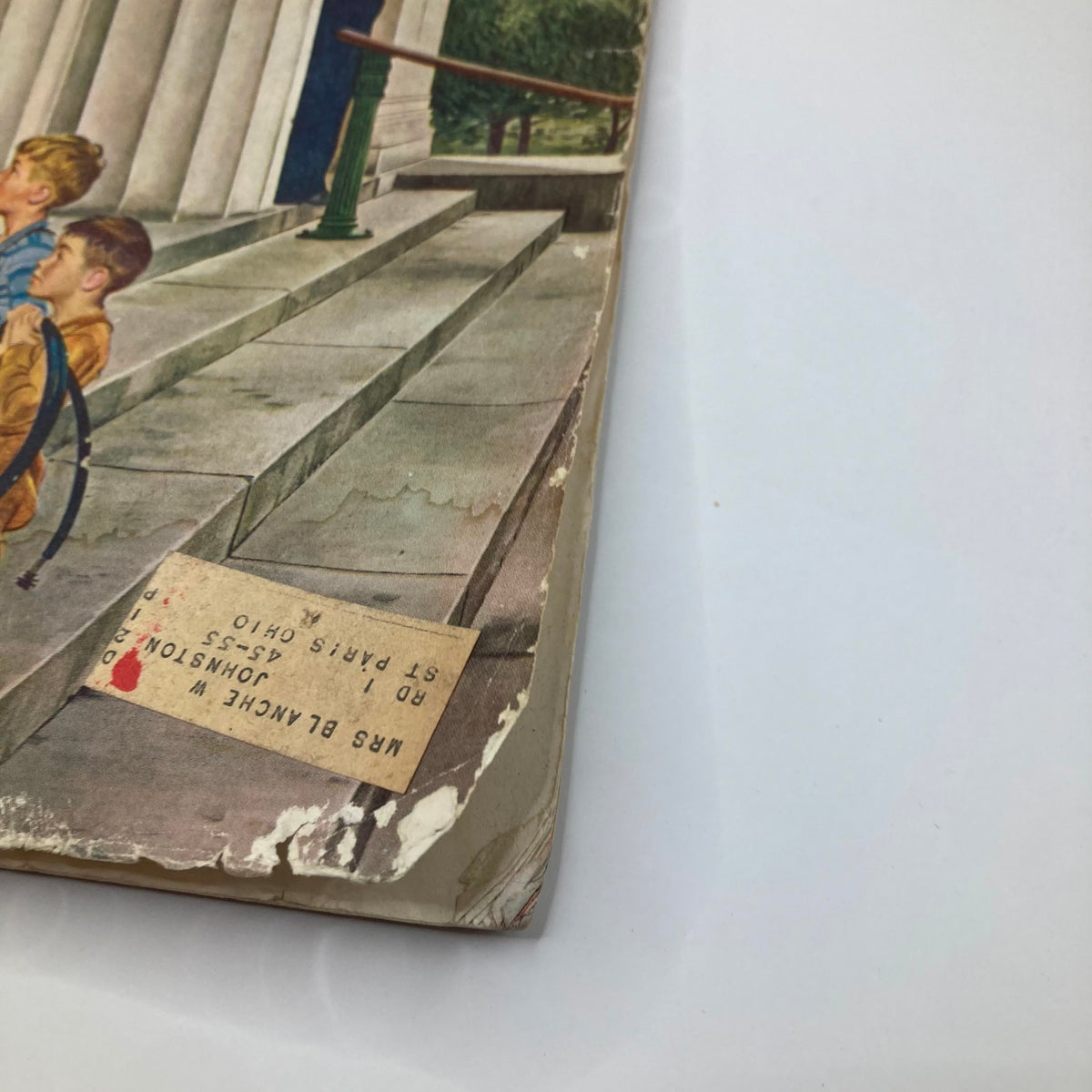 Side view of the Saturday Evening Post Magazine from May 15, 1954, displaying the worn edge and a label with a previous owner's information.