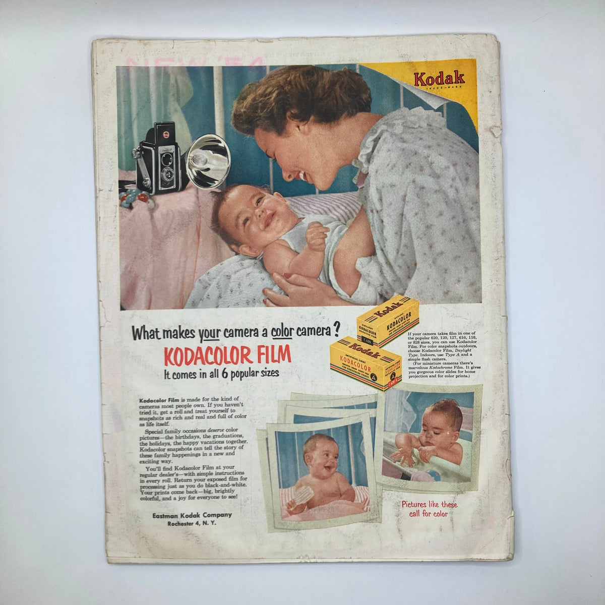 Vintage advertisement for Kodak featuring a mother and baby promoting Kodacolor Film, showcasing nostalgic imagery in the Saturday Evening Post Magazine February 13 1954.