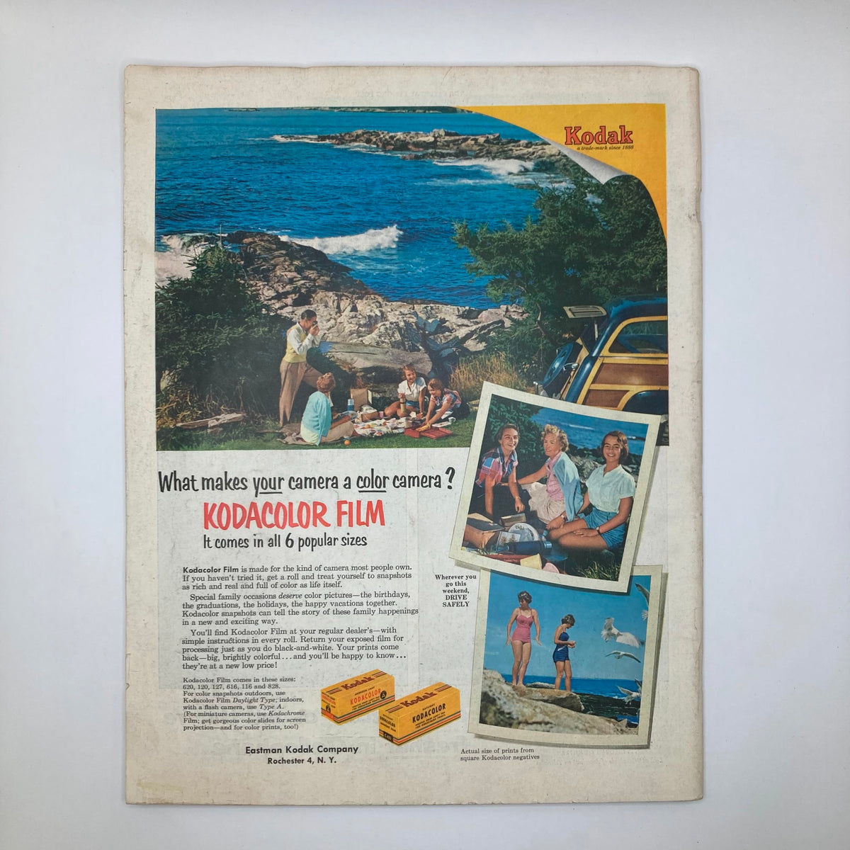 Advertisement for Kodak color film on the back of the Saturday Evening Post Magazine from June 5, 1954, showcasing a family picnic at the beach with vibrant visuals.