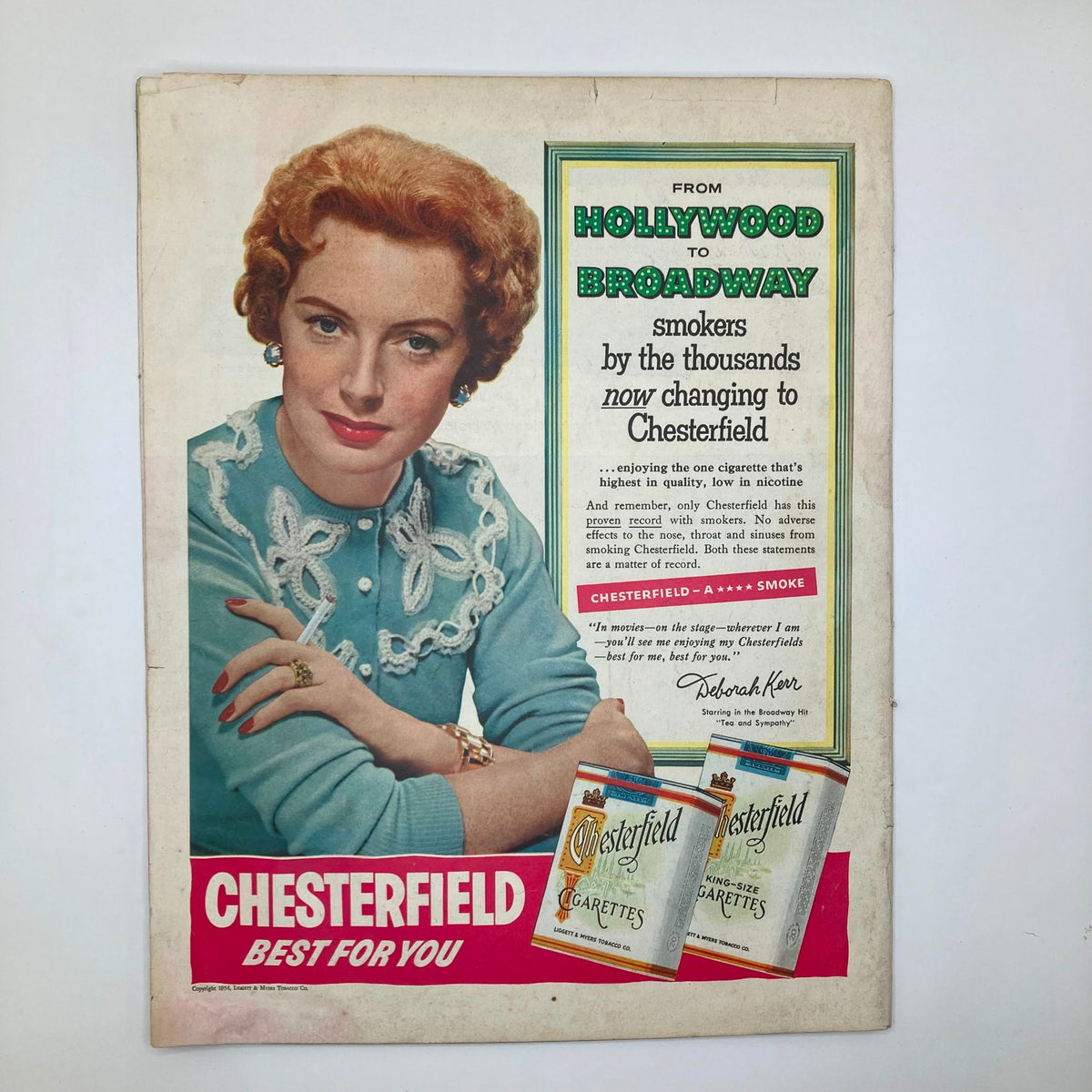 Vintage advertisement from the Saturday Evening Post Magazine January 30, 1954, promoting Chesterfield cigarettes with a model showcasing the product and text highlighting its quality.