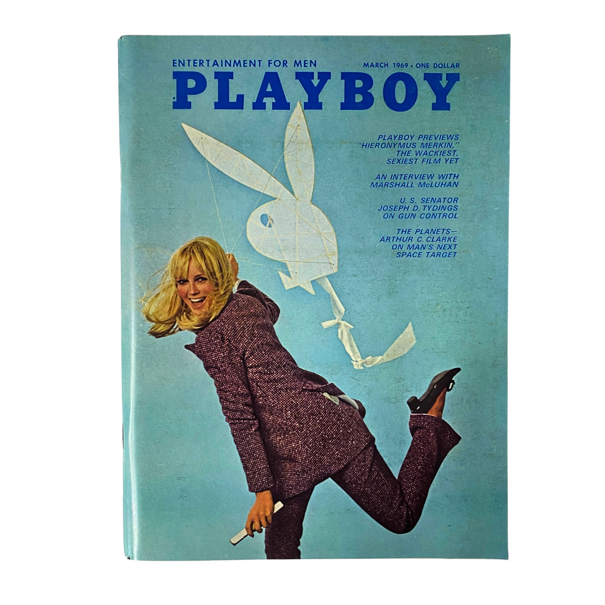 Playboy Magazine March 1969 cover featuring Kathy MacDonald in a stylish outfit, with a playful pose and iconic Playboy logo, showcasing the cultural significance of vintage magazines.