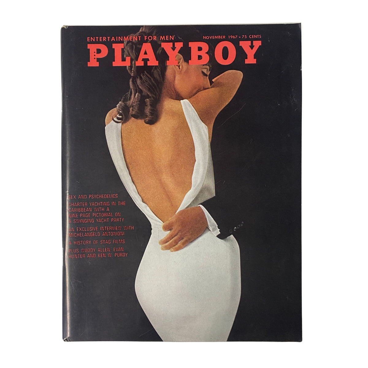 Playboy Magazine November 1967 cover featuring a striking image of a woman in a backless dress with a unique perspective, highlighting the allure of the Playmate Kaya Christian.