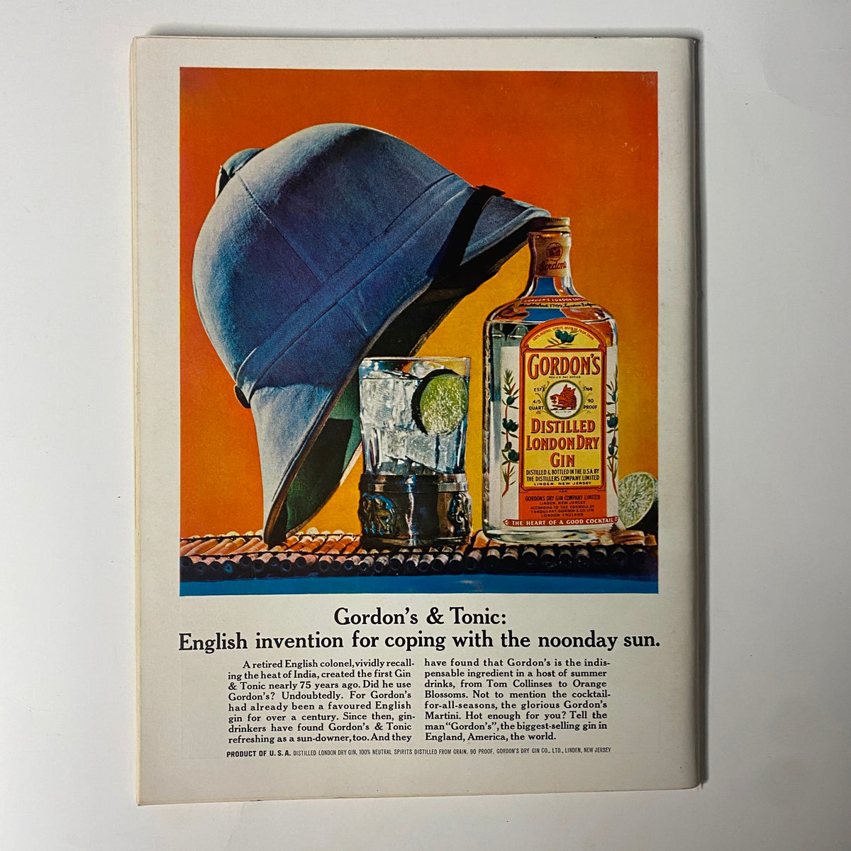 Vintage advertisement for Gordon's London Dry Gin from Playboy Magazine July 1964, showcasing a hat and a refreshing drink.