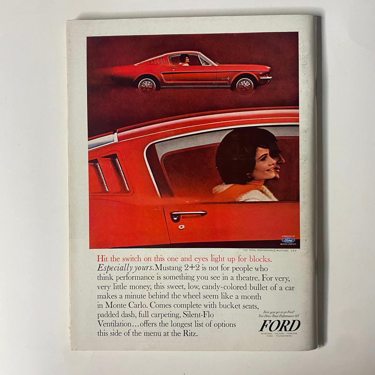 Playboy Magazine December 1964 advertisement featuring a Ford Mustang. The ad showcases a vintage car with a woman inside, illustrating the era's automotive design alongside the magazine's cultural context.