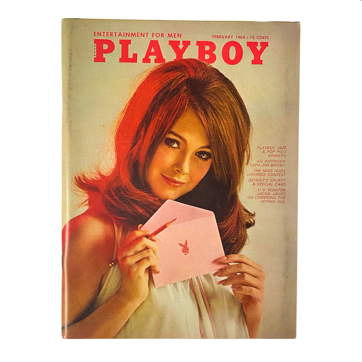 Cover of Playboy Magazine February 1968 featuring Playmate Nancy Harwood, showcasing her beauty with a playful pose holding a pink envelope, highlighting the vintage aesthetic and cultural significance of the era.