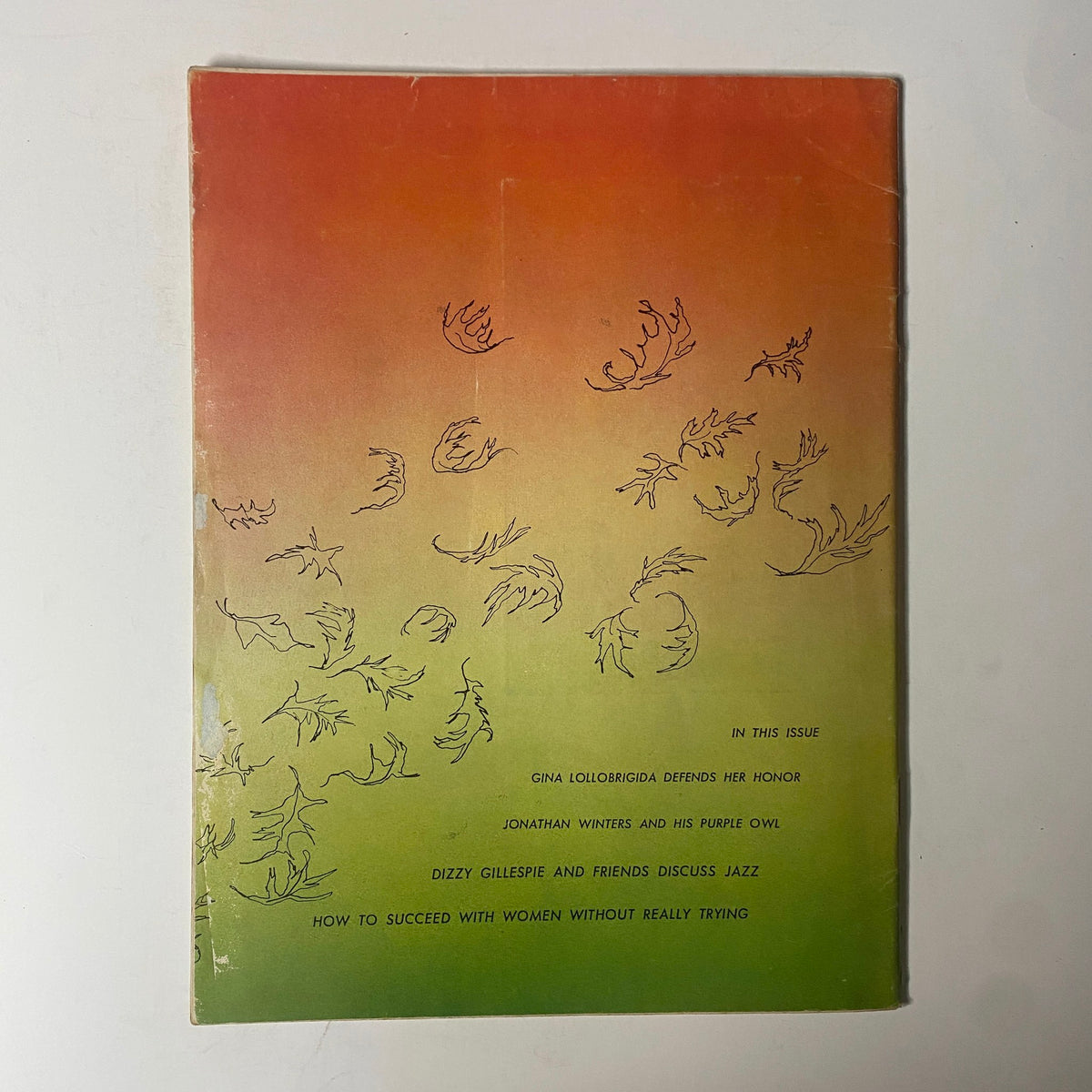 Back cover of Playboy Magazine November 1955 showcasing an abstract design with playful, whimsical illustrations, reflecting the artistic style of the era.
