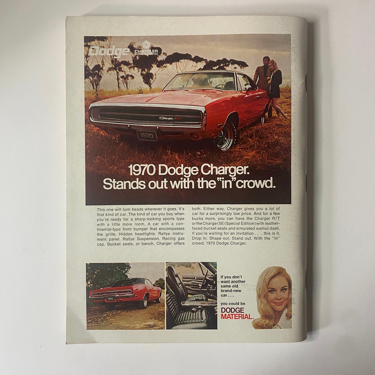 Advertisement page from Playboy Magazine December 1969 featuring the 1970 Dodge Charger with a classic design and promotional text.