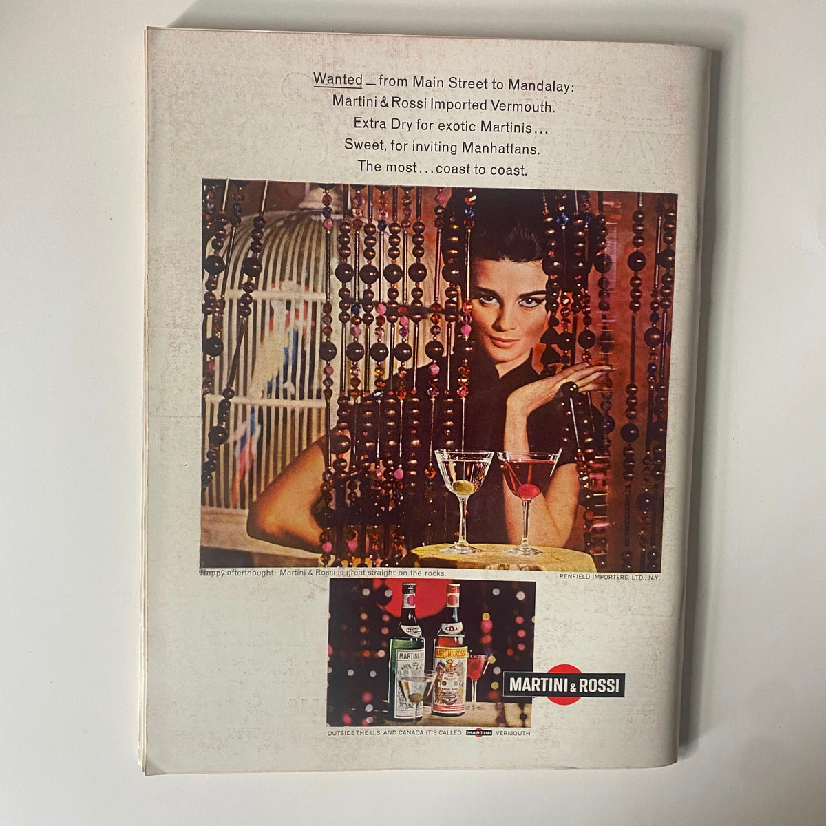 Back cover of Playboy Magazine September 1966 with an advertisement for Martini & Rossi vermouth, featuring a stylish woman and retro design.