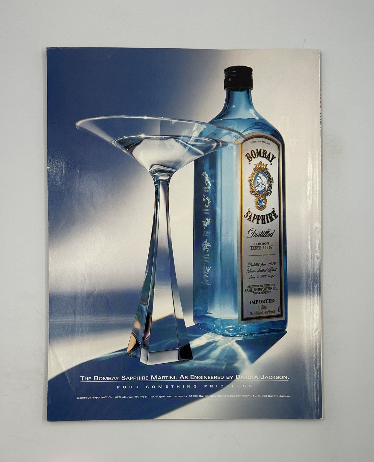 Advertisement for Bombay Sapphire Martini featured in George Magazine May 1999, showcasing a striking cocktail glass and bottle.
