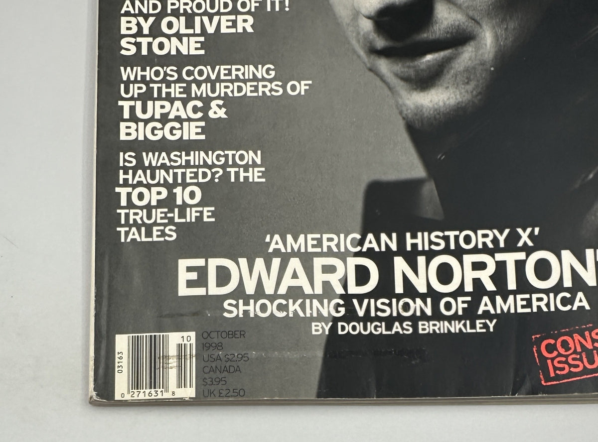 Close-up detail of George Magazine October 1998 highlighting the issue date, featuring Edward Norton and articles about Oliver Stone and the Tupac and Biggie murders.