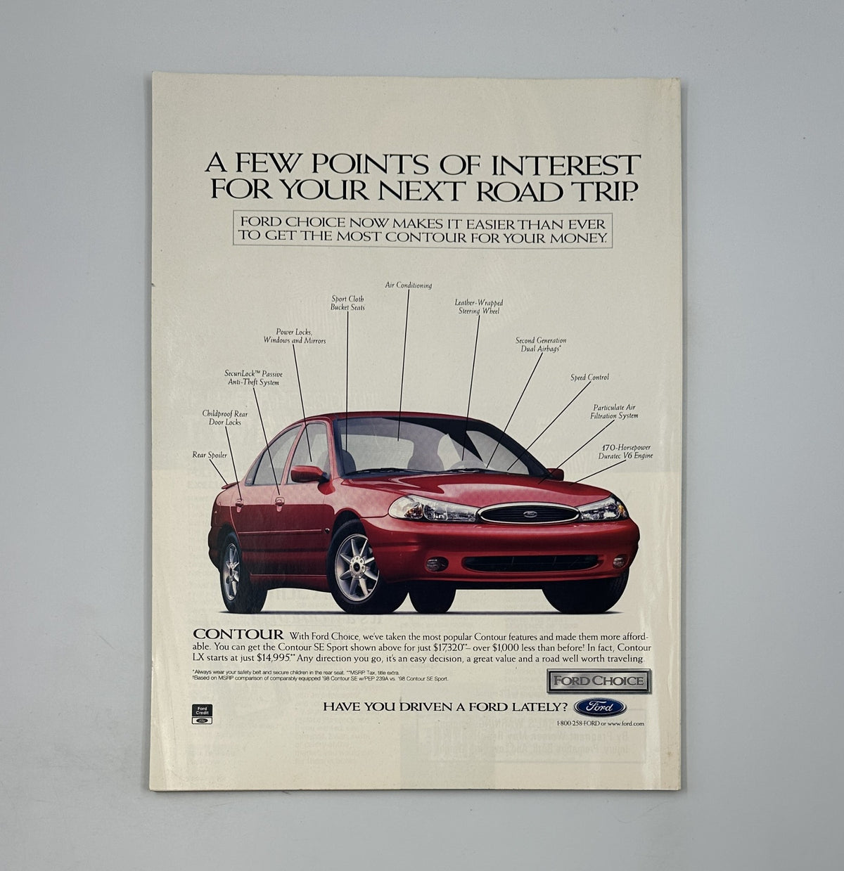 Advertisement for the Ford Contour car in George Magazine February 1998, illustrating features for an enjoyable road trip.