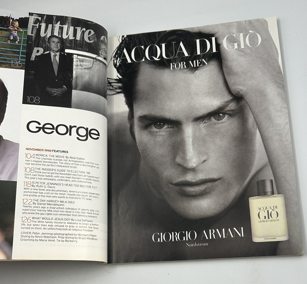 Inside spread of George Magazine from November 1998 showcasing a Giorgio Armani advertisement for Acqua di Gio for men, alongside the magazine's feature content.