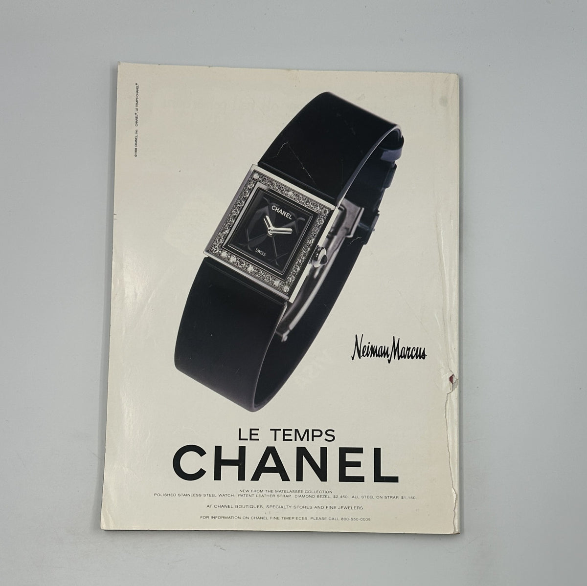 Chanel watch advertisement from Neiman Marcus displayed in George Magazine November 1998, focusing on luxury timepieces.