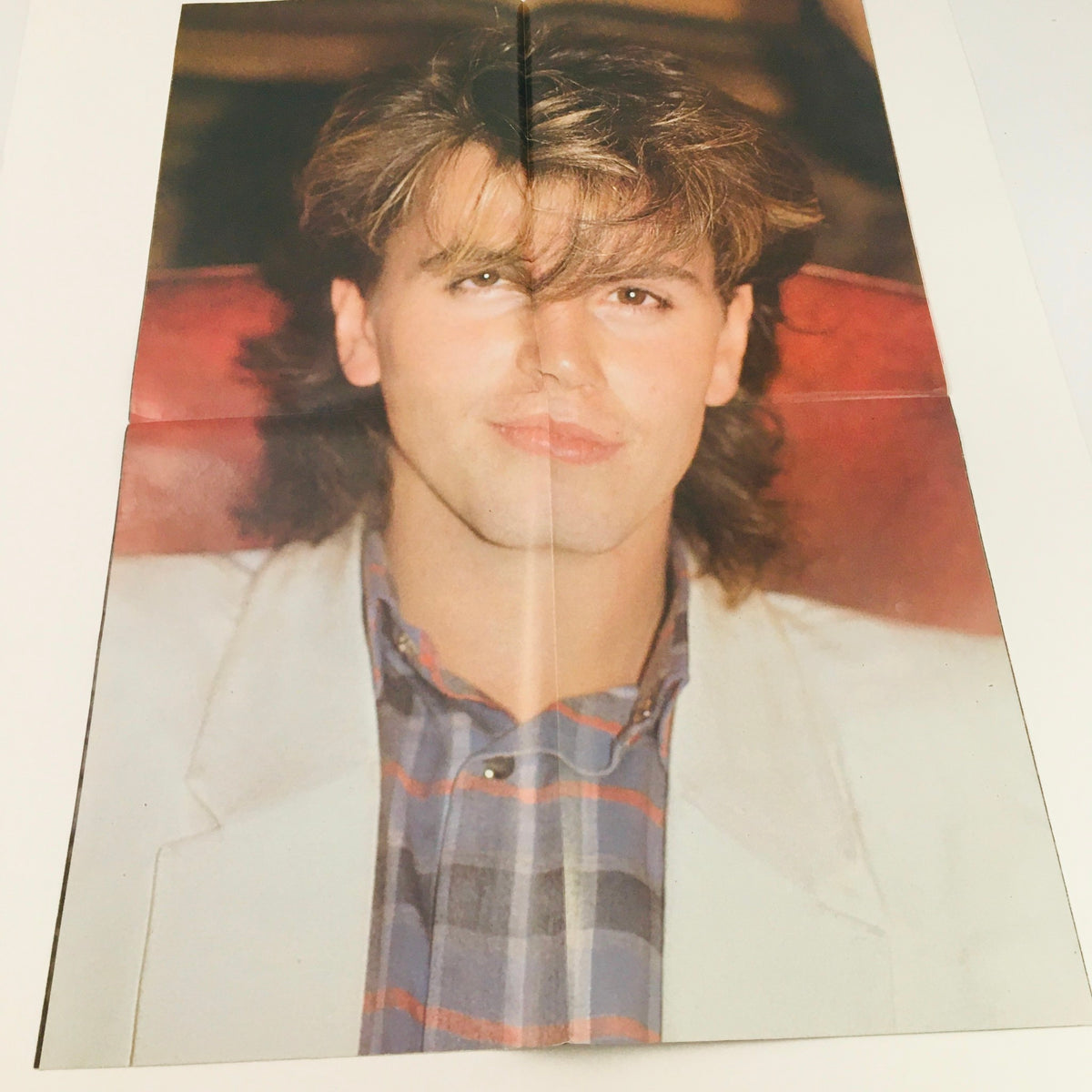 Inside the Pop Gallery Poster Magazine #15, a folded poster of Duran Duran's Simon Le Bon. This vintage magazine includes a unique display piece that highlights the band's style and cultural impact during the 1980s.