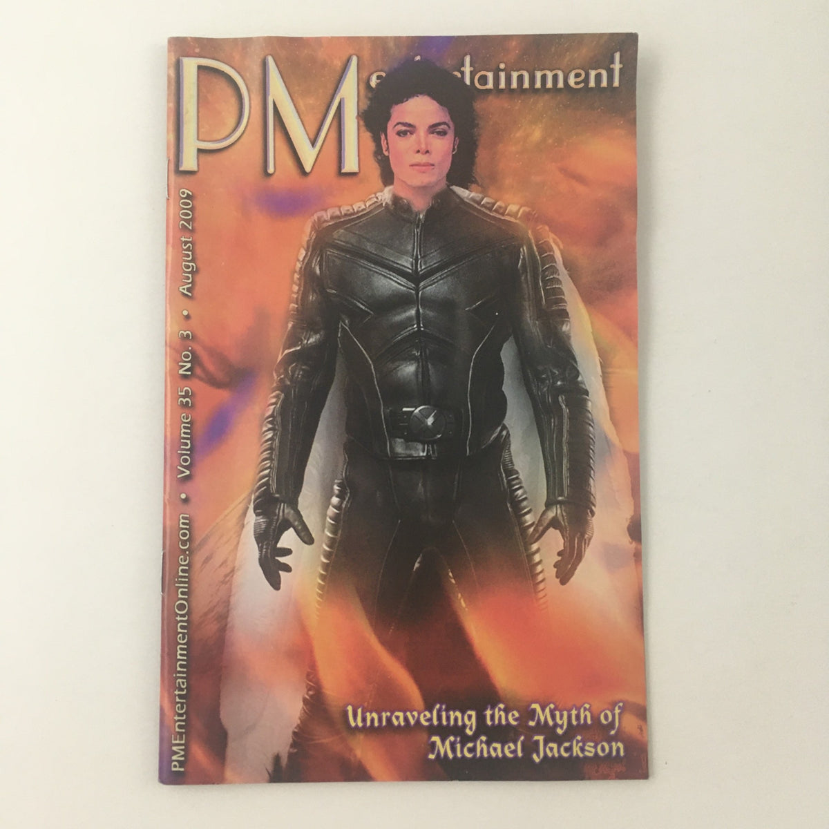 Cover of PM Entertainment Magazine August 2009 featuring an iconic image of Michael Jackson, titled 'Unraveling the Myth of Michael Jackson', showcasing his unique style and dynamic presence.