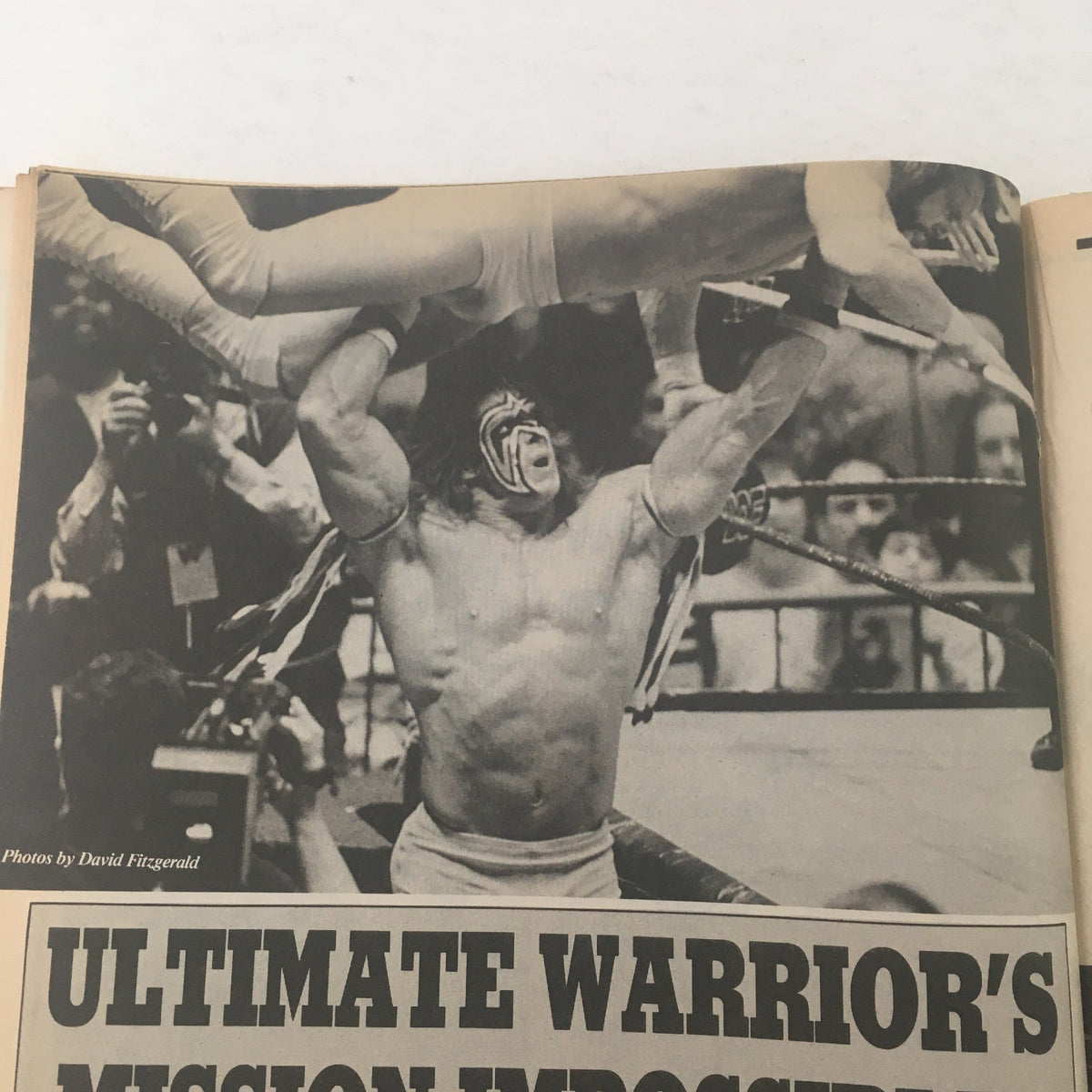 The Wrestler Magazine June 1989 image featuring Ultimate Warrior performing an impressive wrestling move during a match.