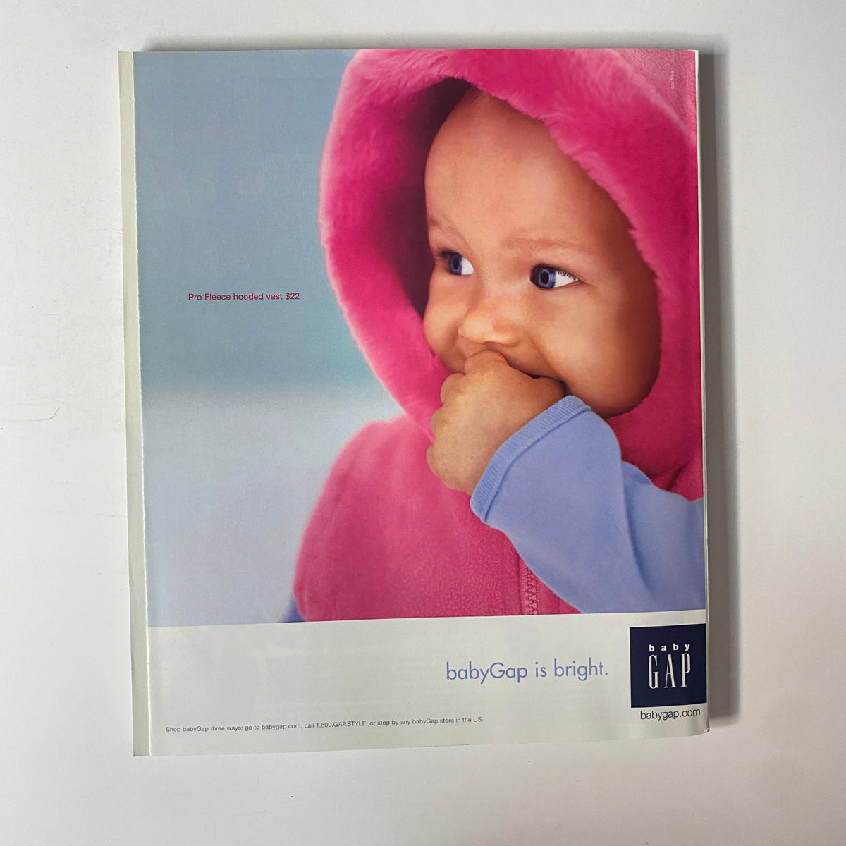 Advertisement page from Martha Stewart Living Magazine November 2000 featuring a babyGap ad with a child in a pink hoodie.