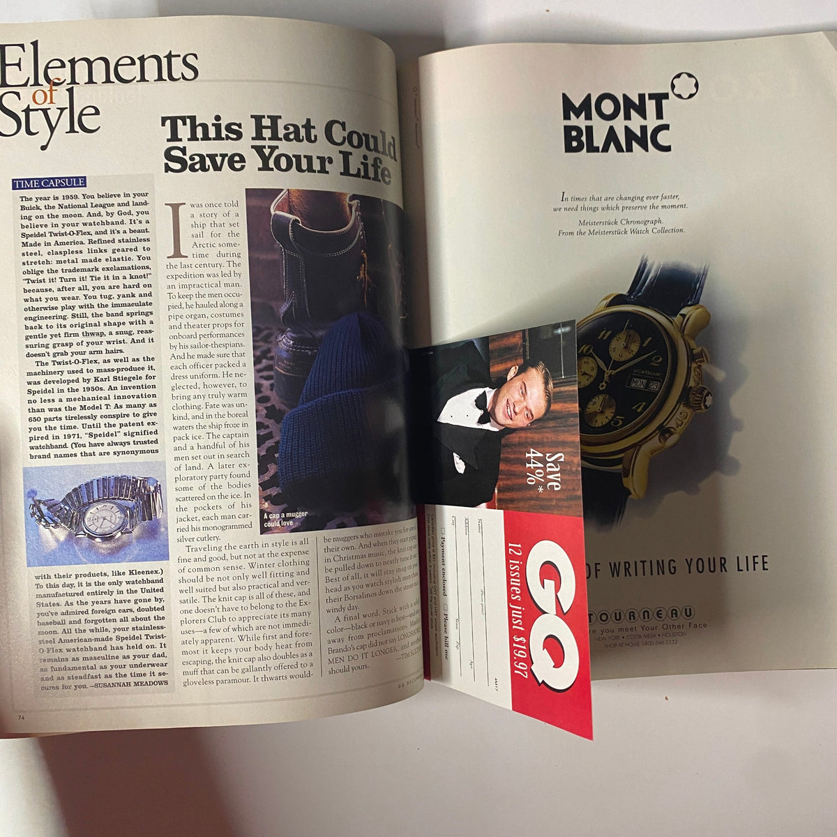GQ Magazine December 1997 featuring an article titled 'This Hat Could Save Your Life' alongside a Mont Blanc advertisement, showcasing fashion and style insights of the late 1990s.