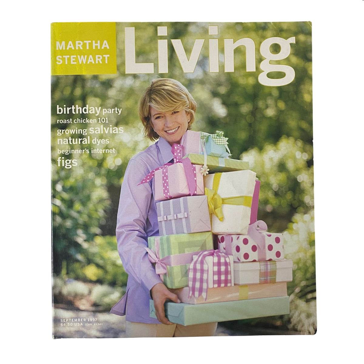Martha Stewart Living Magazine September 1997 cover featuring Martha Stewart with colorful wrapped presents, showcasing seasonal themes like birthday parties, gardening, salvia plants, and figs.