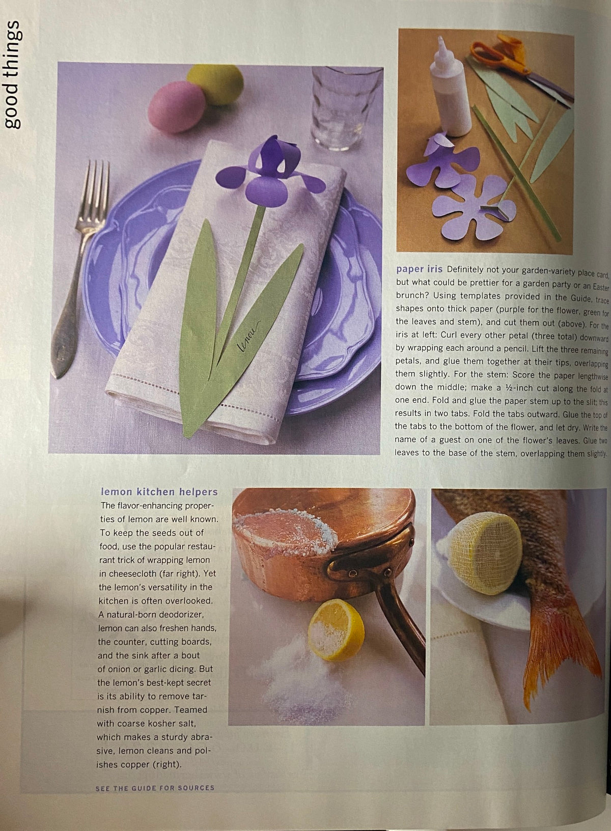 Detailed view of a paper iris decoration on a dinner table featuring a purple flower and green leaves, with Easter eggs in the background, from the Martha Stewart Living Magazine April 1997 issue.