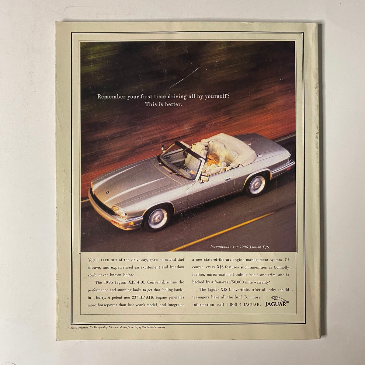 Advertisement page from Martha Stewart Living Magazine April 1995 promoting the 1995 Jaguar XJS Convertible with a stylish design.