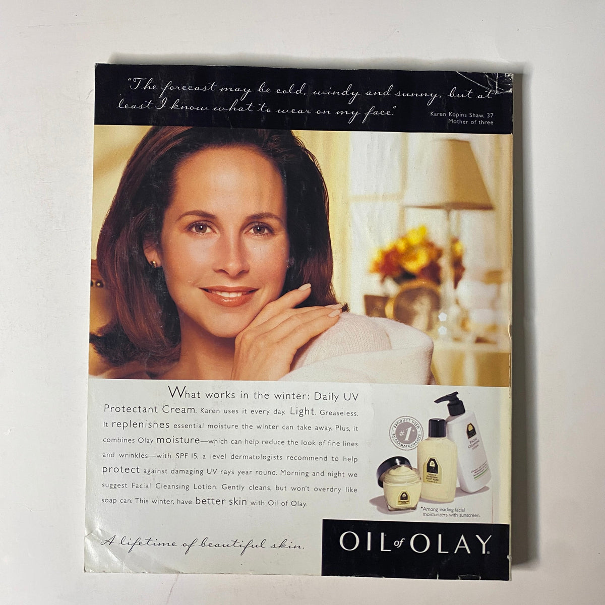 Promotional advertisement for Oil of Olay displayed in Martha Stewart Living Magazine November 1996, featuring a smiling woman and skincare products for winter care.