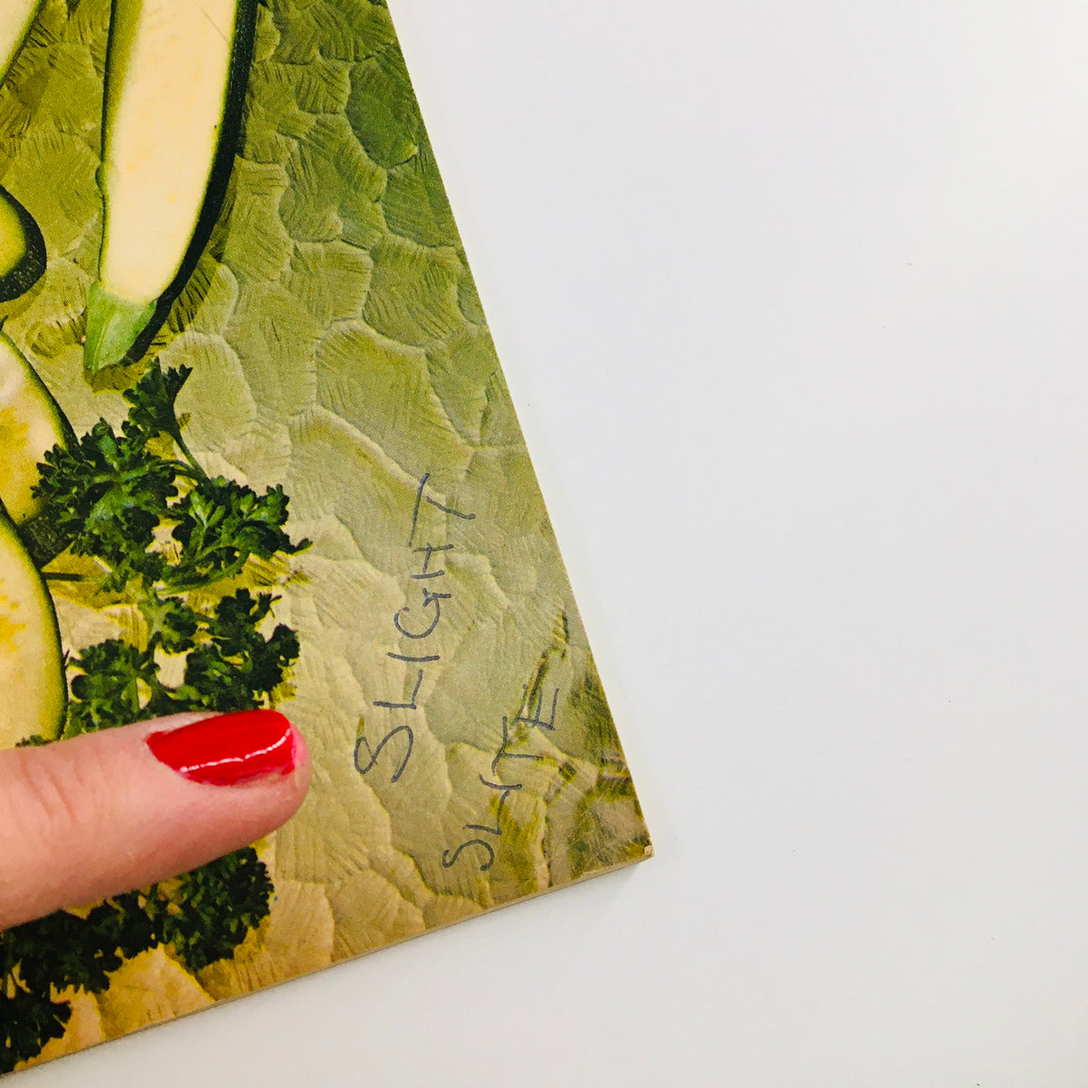 Close-up view of the Gourmet Magazine of Good Living, September 1968, showing detail of the cover with the handwritten note 'SLIGHT' near the edge.