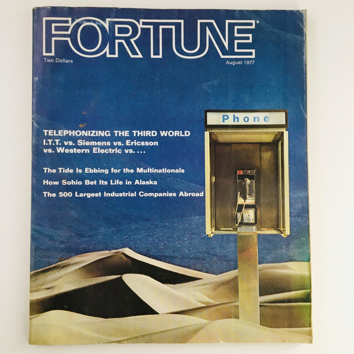 Cover of Fortune Magazine, August 1977 edition titled 'Telephonizing The Third World', featuring a phone booth and articles on telecommunications advancements and global companies.