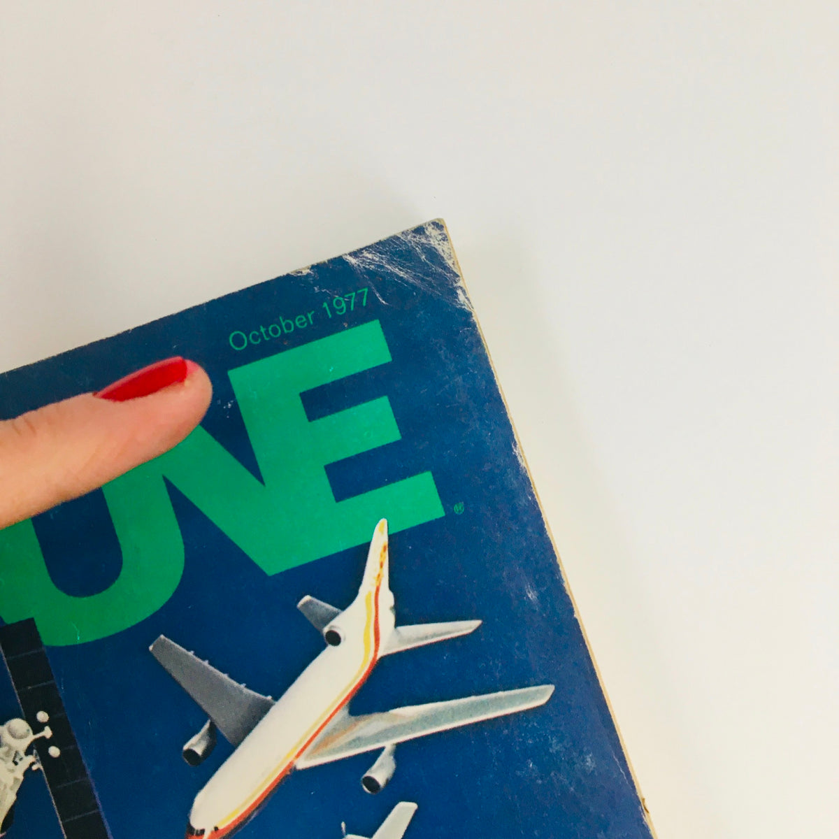 Fortune Magazine October 1977 corner featuring the month and year, with an airplane illustration and bold 'FORTUNE' title.