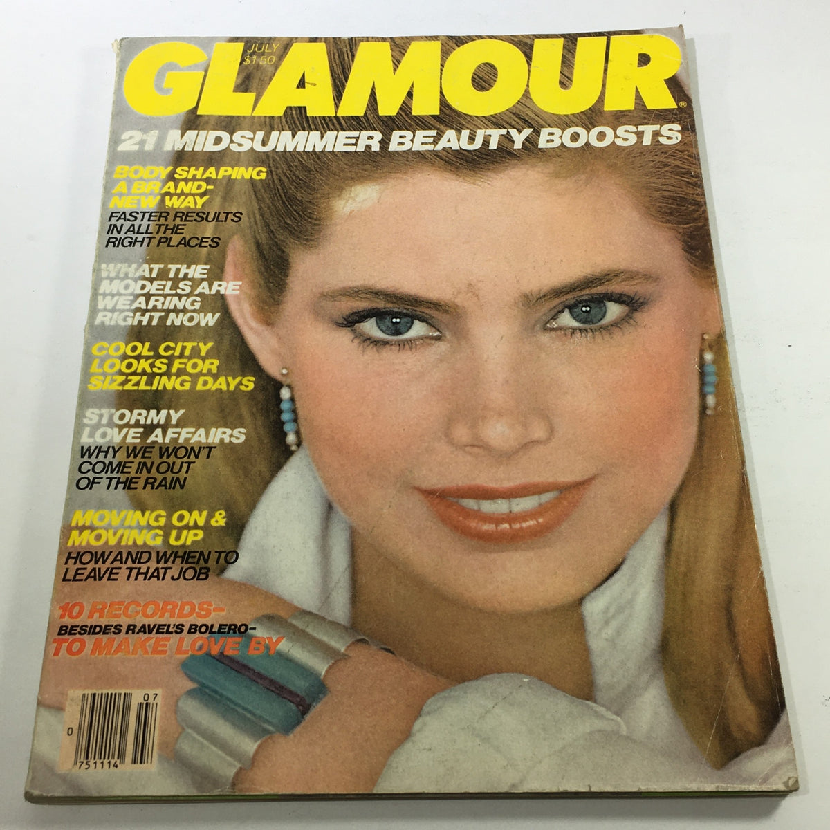 Cover of VTG Glamour Magazine: July 1980 featuring a model with blonde hair and blue eyes, promoting '21 Midsummer Beauty Boosts'. The magazine showcases beauty and lifestyle tips with vibrant titles like 'Body Shaping A Brand-New Way' and 'Cool City Looks for Sizzling Days'.