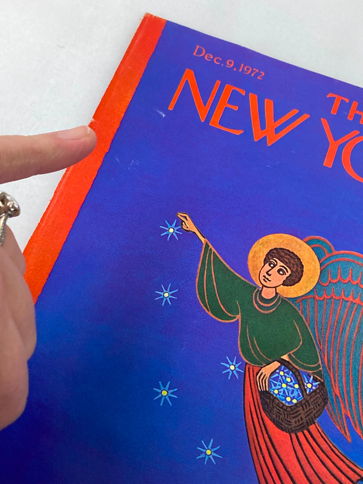 Close-up view of The New Yorker cover, December 9, 1972, 'Holy Night' by Charles Martin, highlighting details of the angel and star imagery.