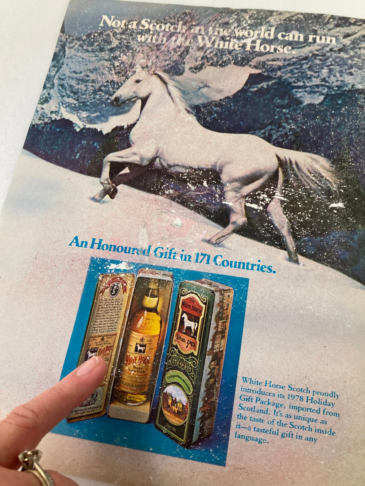 Back cover of The New Yorker December 11, 1978 issue, featuring an advertisement for White Horse Scotch with imagery of a white horse and gift packaging.