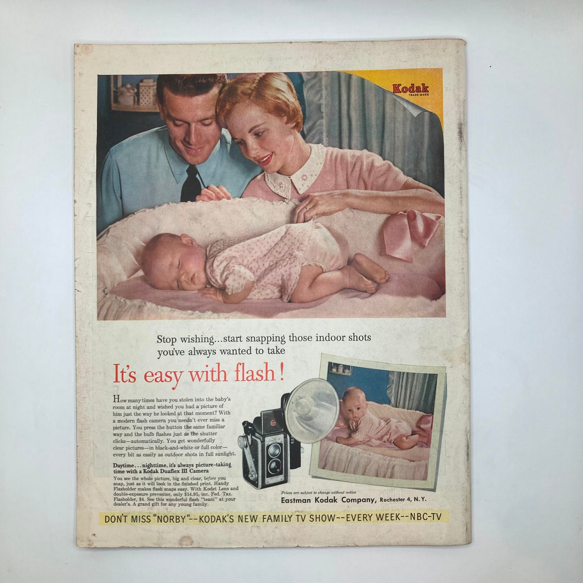 Back cover of the Saturday Evening Post Magazine March 12, 1955 featuring a vintage Kodak advertisement promoting family photography.