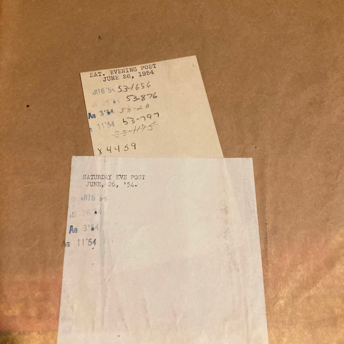 Details of the Saturday Evening Post Magazine from June 26, 1954, featuring handwritten notes and markings. Includes notes referencing the magazine's publication date and identification numbers.