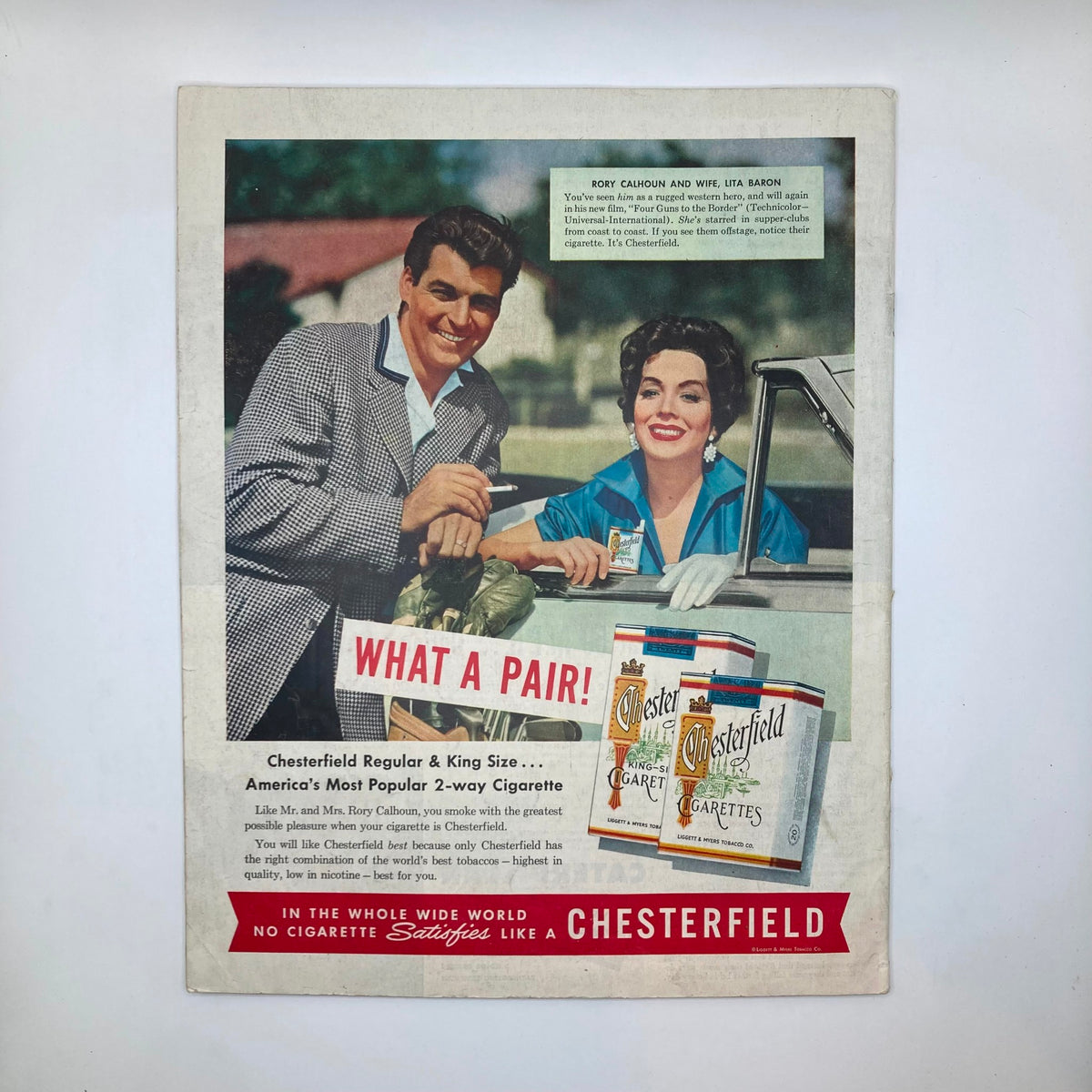 Vintage advertisement featuring a man and woman promoting Chesterfield cigarettes, from the January 1, 1955, issue of Saturday Evening Post Magazine, showcasing mid-20th century Americana.