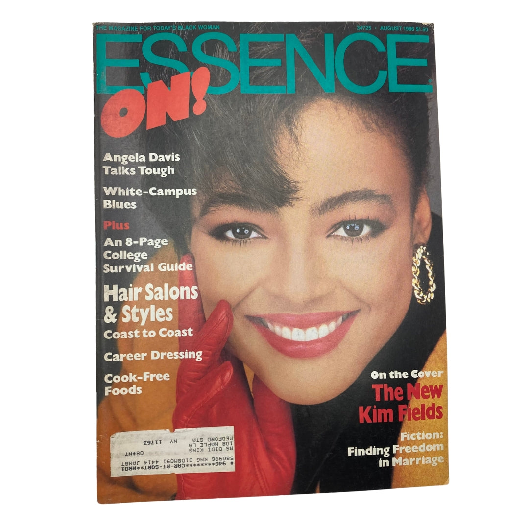 Essence Magazine August 1986 cover featuring actress Kim Fields, showcasing her radiant smile and striking style, emphasizing empowerment and beauty topics relevant to African American culture.
